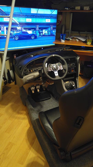 Illustration for article titled Totally amazing home built racing simulator found on Facebook!!!